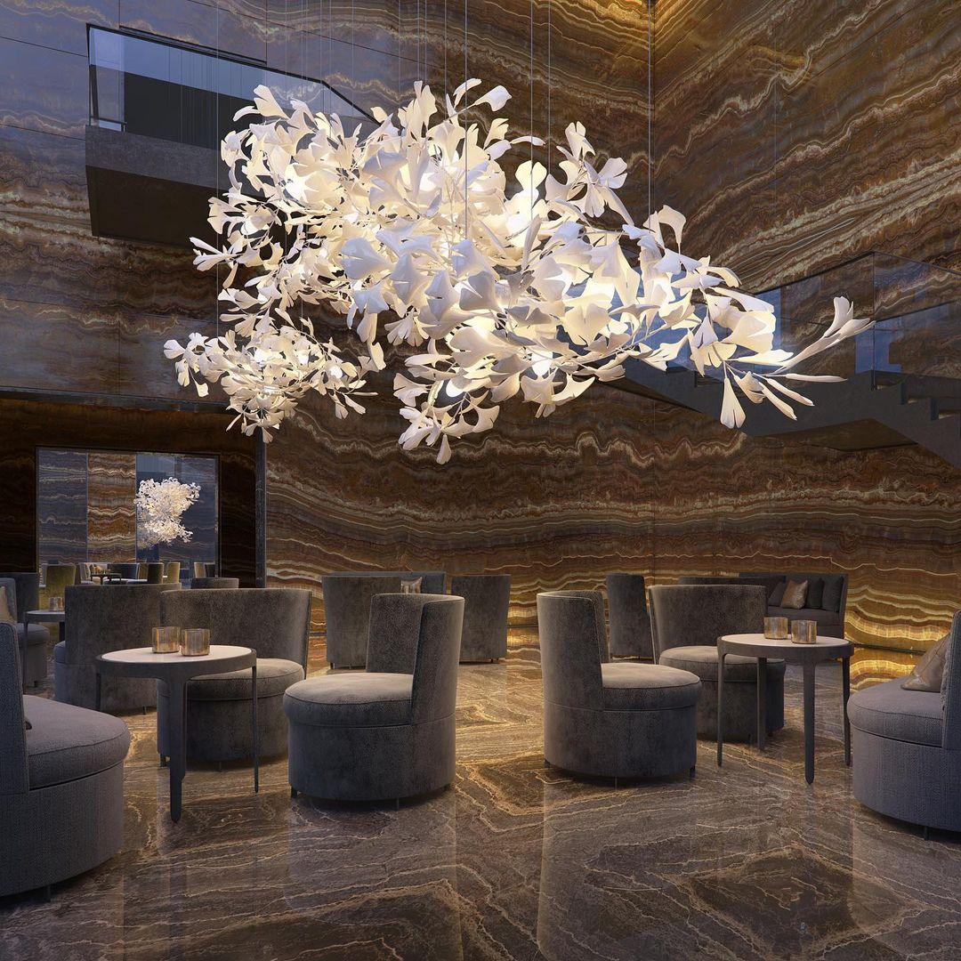 Korewolamp Gingko Ceramic Chandelier with multiple ginkgo leaf-shaped light fixtures hanging from a sleek frame.