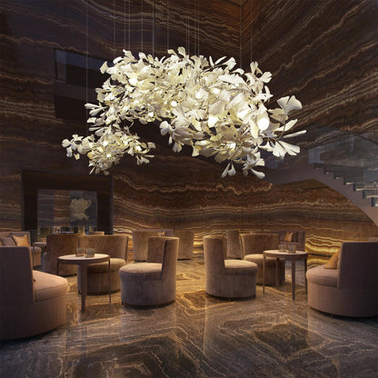 Korewolamp Gingko ceramic chandelier with ginkgo leaf design, featuring multiple hanging light bulbs in a modern, artistic style.