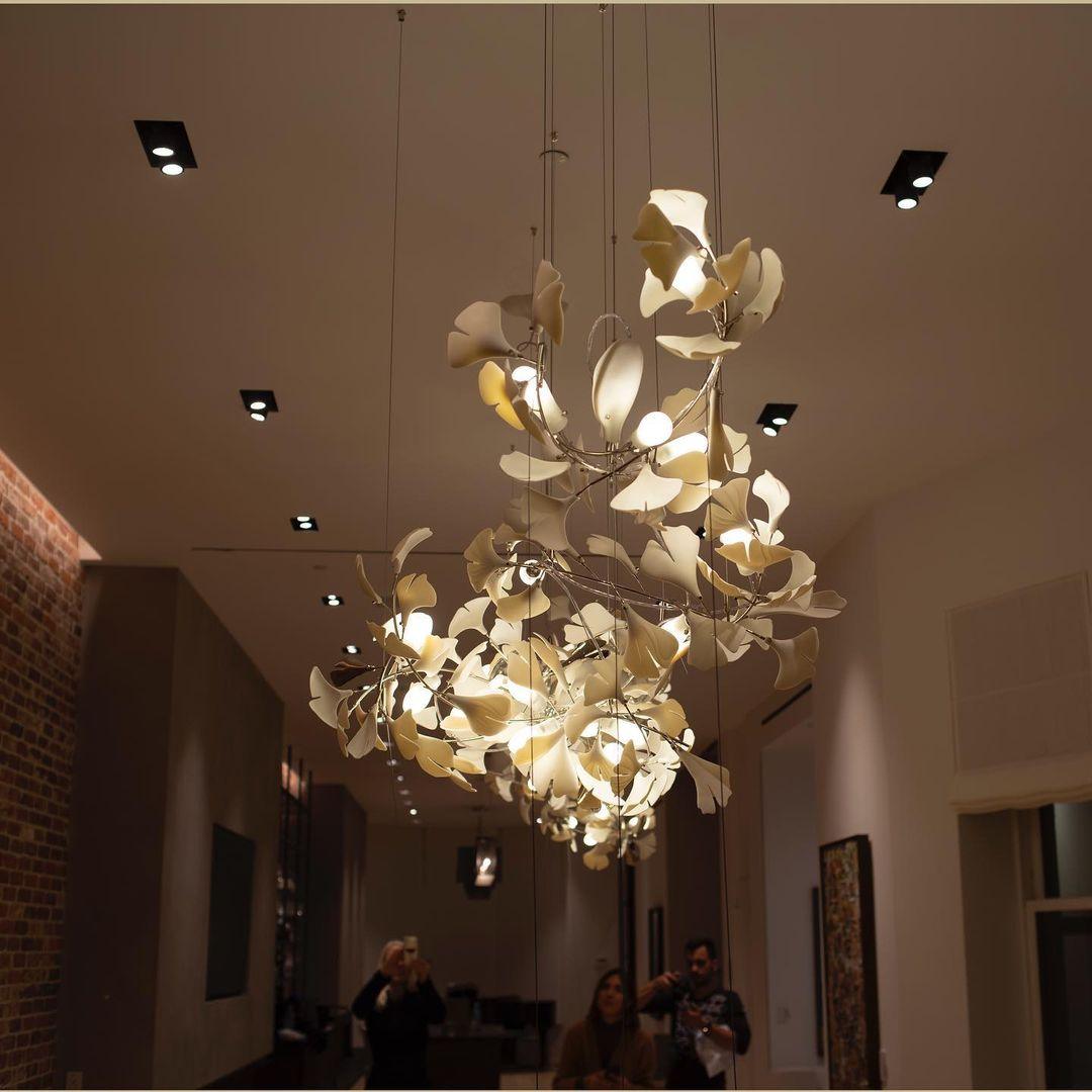 Korewolamp Gingko Ceramic Chandelier with ginkgo leaf-shaped design, hanging from a metal frame, modern lighting fixture.