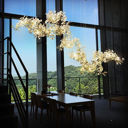 Korewolamp Gingko Ceramic Chandelier with leaf-shaped design, featuring multiple hanging lights and a modern aesthetic.