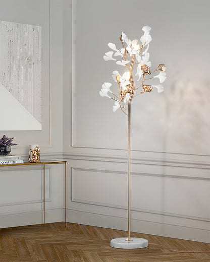 Korewolamp Gingko floor lamp with a modern design, featuring a sleek stand and a large, leaf-shaped lampshade in a stylish setting.