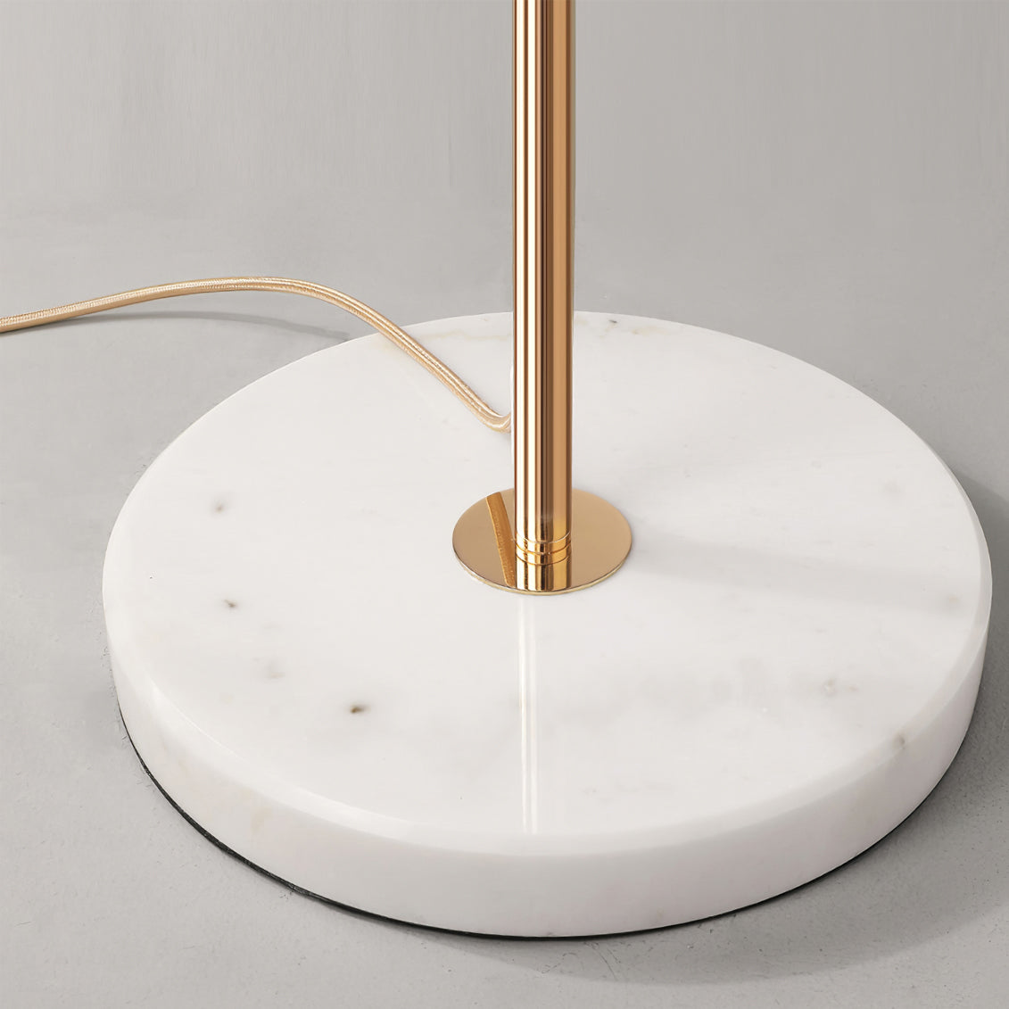 Korewolamp Gingko Floor Lamp with a sleek, modern design featuring a curved metal stand and a white fabric lampshade.