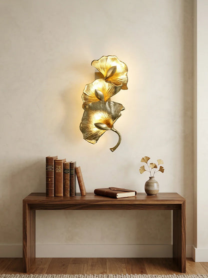 Ginkgo leaf wall lamp by korewolamp, decorative lighting fixture with leaf-shaped design, mounted on a wall in a modern interior.