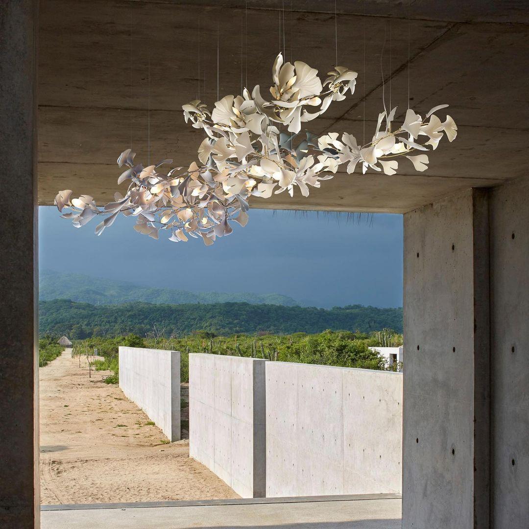 Ginkgo ceramic chandelier by Korewolamp featuring leaf-shaped ceramic shades hanging in a modern design.