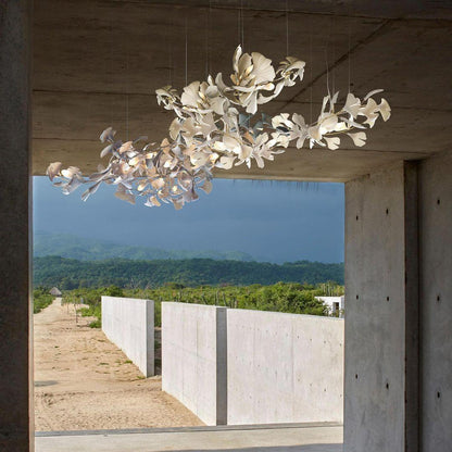 Ginkgo ceramic chandelier by Korewolamp featuring leaf-shaped ceramic shades hanging in a modern design.