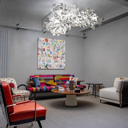 Korewolamp Gingko Ceramic Chandelier with leaf-shaped design, hanging from a ceiling in a modern interior setting.