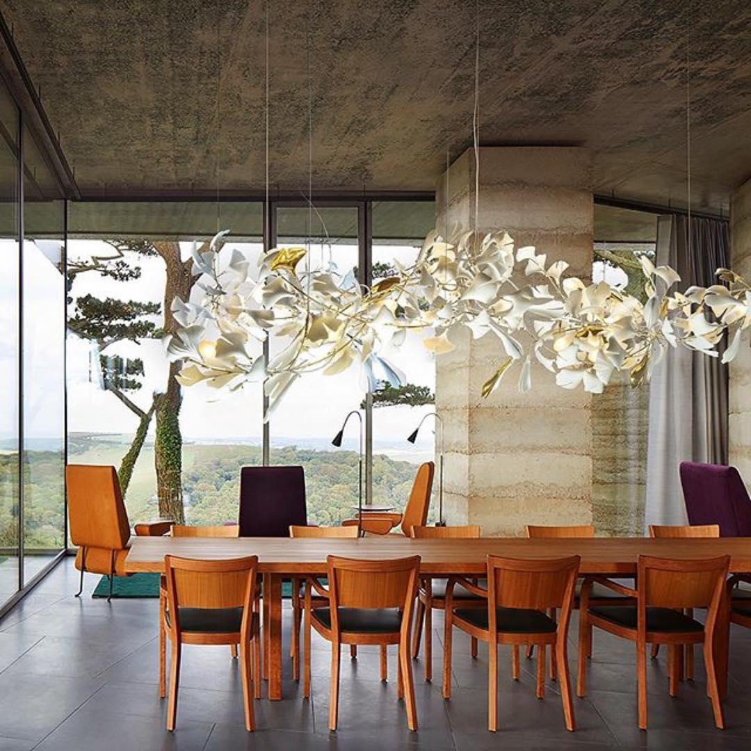 Gingko Ceramic Chandelier by Korewolamp featuring leaf-shaped ceramic design with warm lighting and elegant hanging structure.