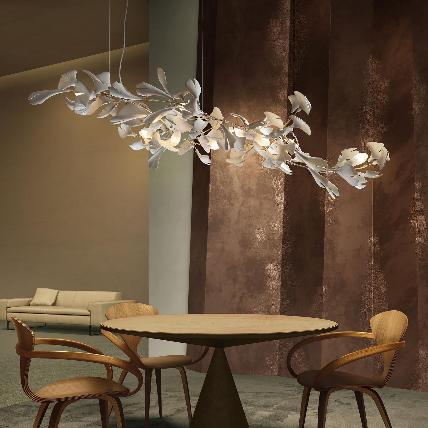 Korewolamp Gingko Ceramic Chandelier with leaf-shaped design, hanging from a chain, elegant lighting fixture.
