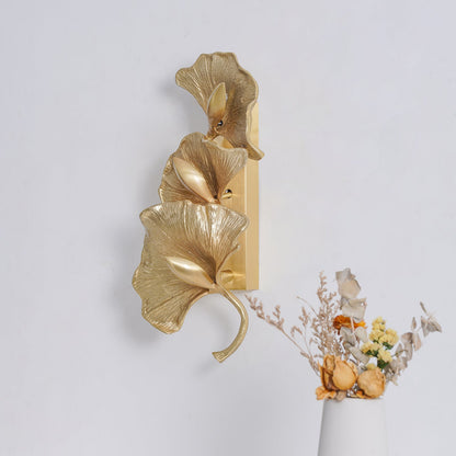 Korewolamp Ginkgo Leaf Wall Lamp showcasing a leaf-shaped design with warm lighting on a wall.