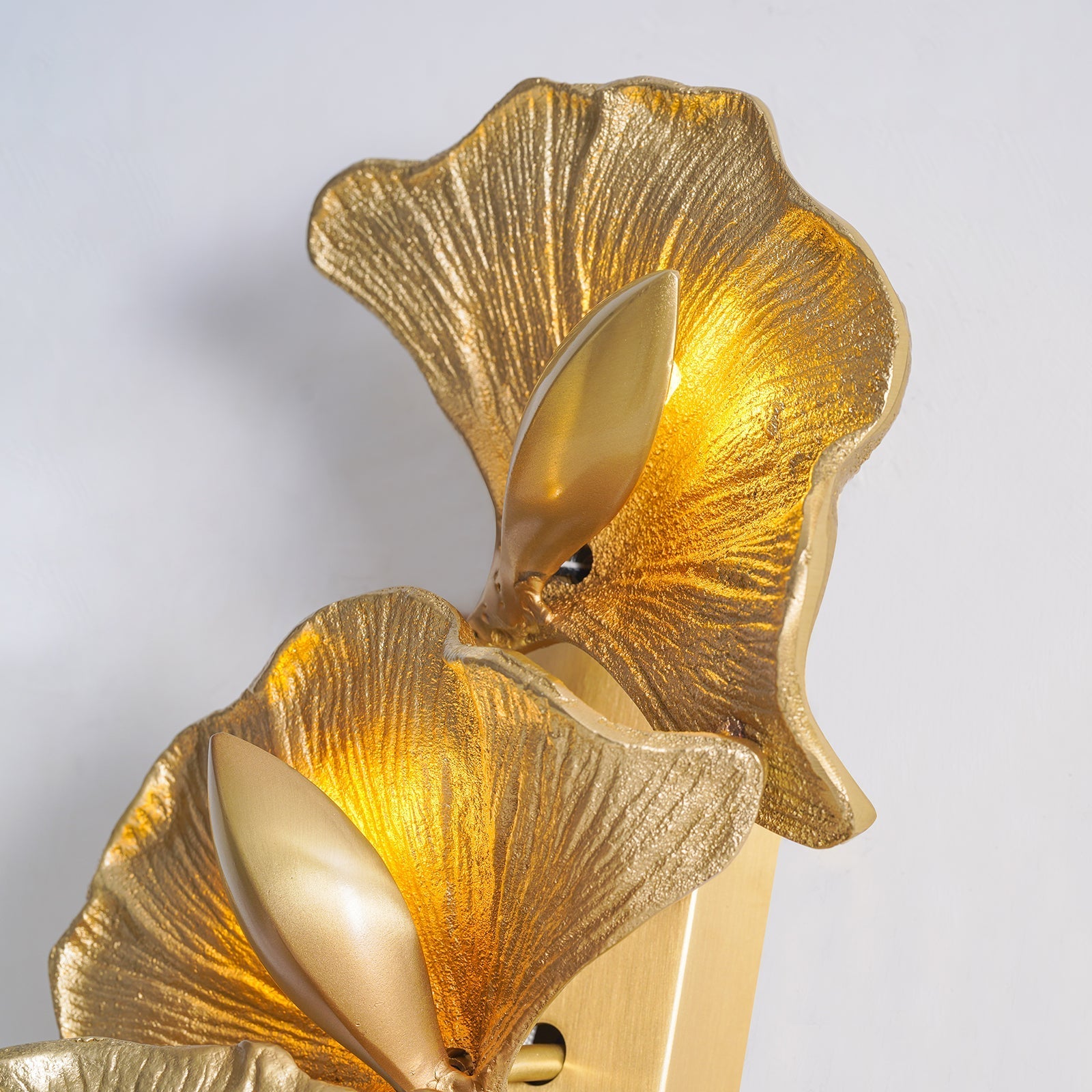 Korewolamp ginkgo leaf wall lamp with illuminated leaf-shaped design, mounted on a wall, showcasing artistic lighting fixture.
