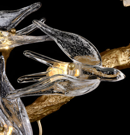 Glass Swallow Chandelier by korewolamp featuring delicate glass swallow motifs hanging from a modern chandelier frame