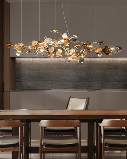Korewolamp gold leaf chandelier with ornate detailing and multiple light fixtures hanging from a decorative frame.