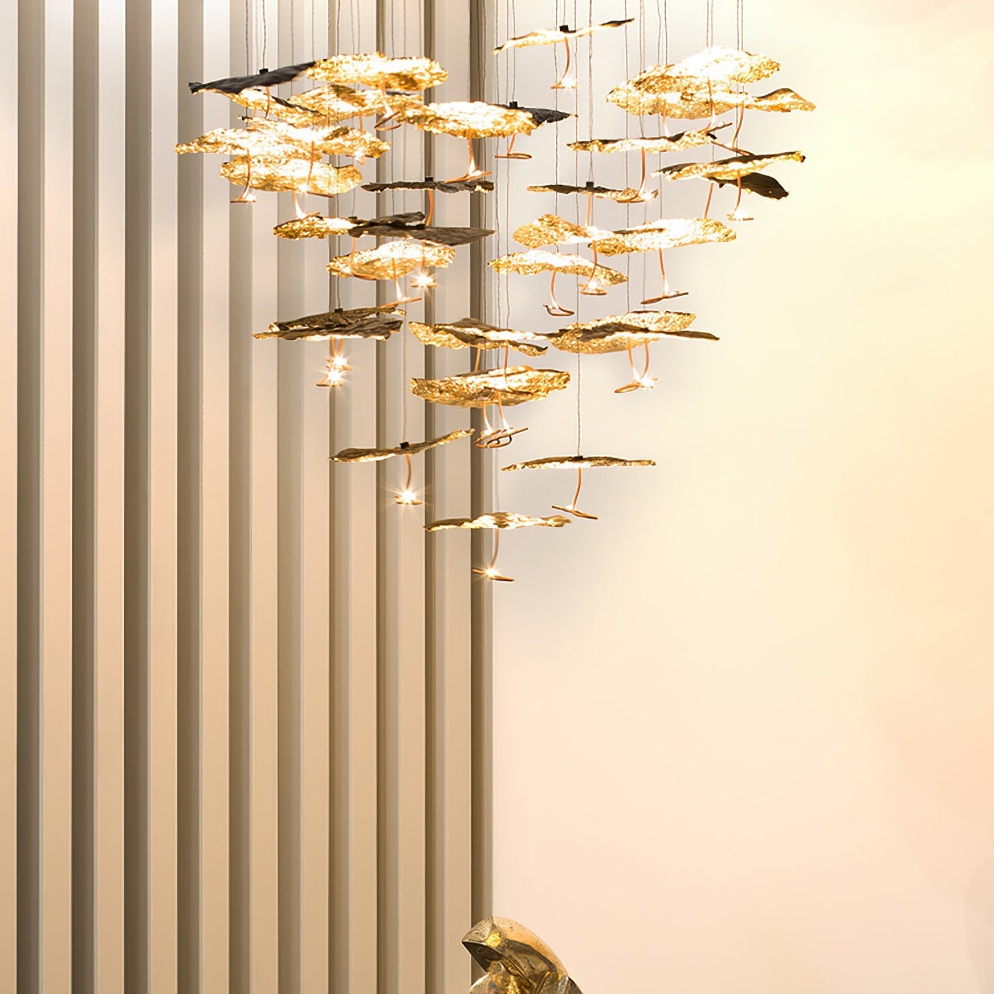 Gold brass aviary constellation chandelier with moon design, featuring intricate branches and hanging light bulbs by korewolamp.
