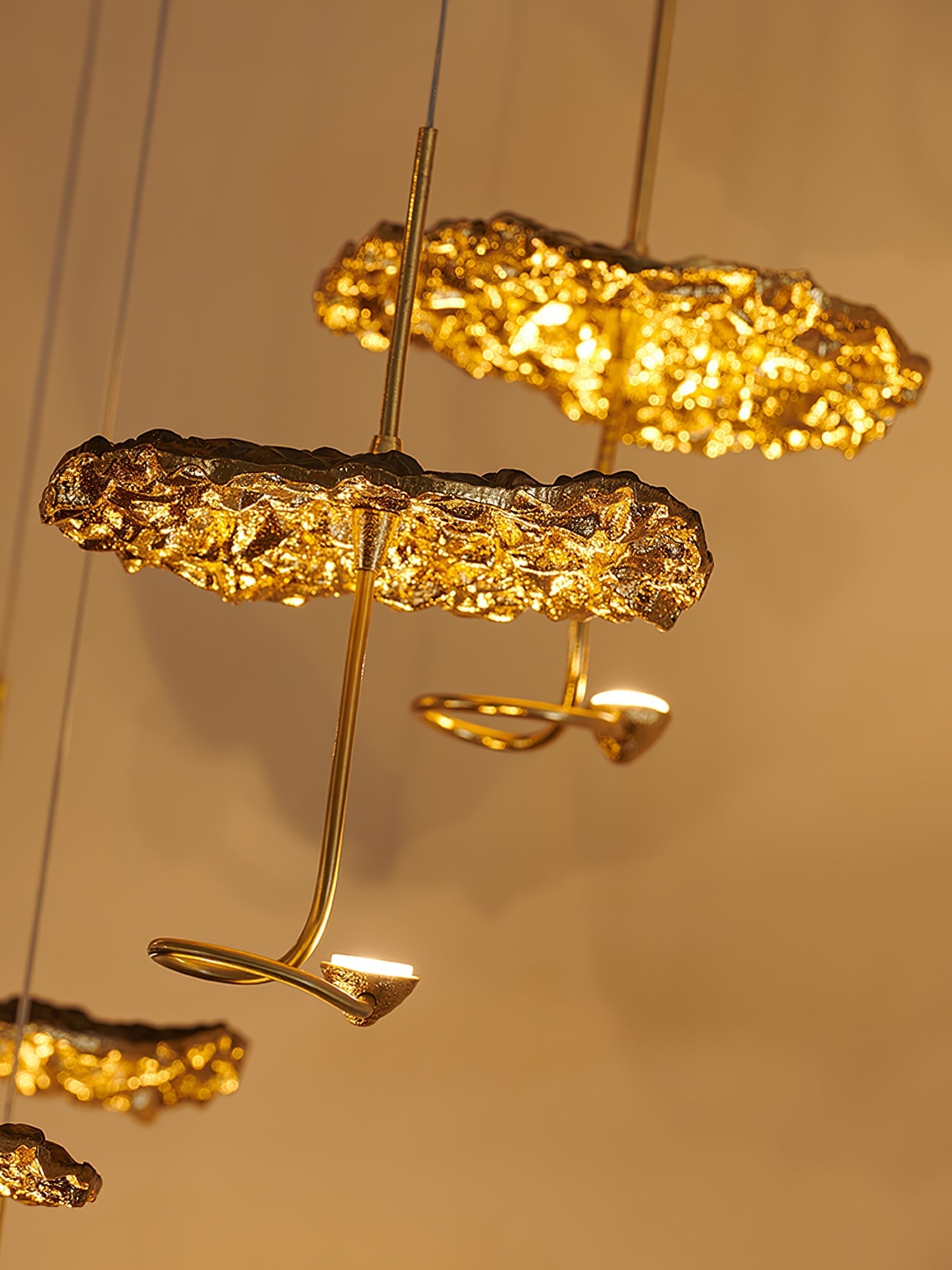 Gold brass aviary constellation chandelier with moon-shaped accents and intricate bird design, hanging with multiple branches.