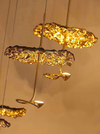 Gold brass aviary constellation chandelier with moon-shaped accents and intricate bird design, hanging with multiple branches.