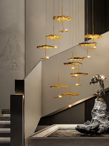 Gold brass aviary constellation chandelier with moon design by korewolamp, featuring intricate star and moon-shaped elements.