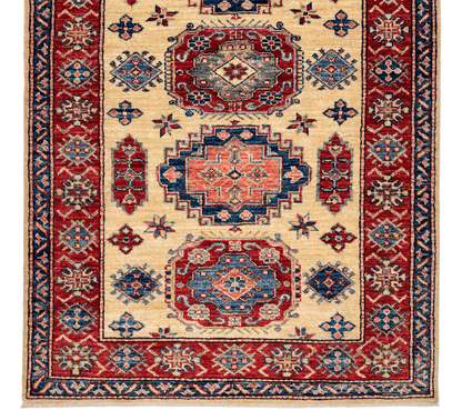 Kirishian Rugs Super Kazak ivory and red area rug, 3'01" x 5'00", featuring traditional geometric patterns and rich colors.