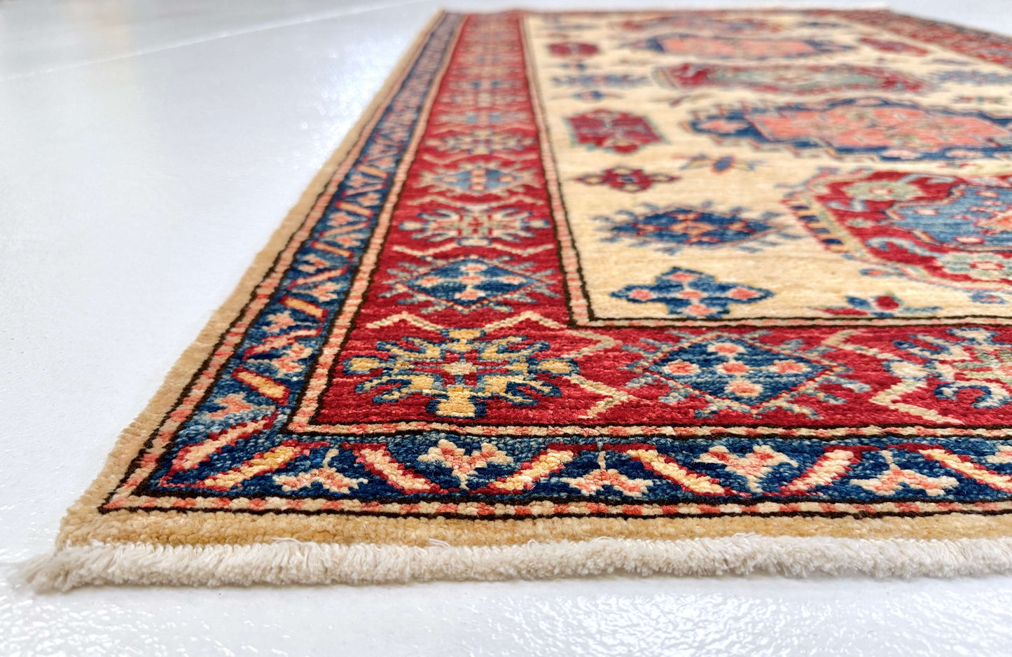 Kirishian Rugs Super Kazak rug, ivory and red, 3'01" x 5'00" with intricate geometric patterns, traditional handmade design.