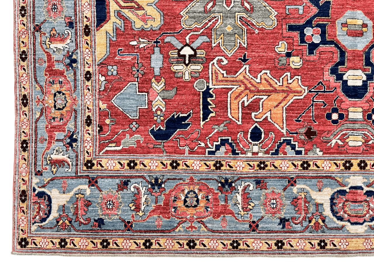 Afghan Heriz area rug by Kirishian Rugs, 9'07" x 13'09", light red and light blue geometric pattern, traditional handmade design.