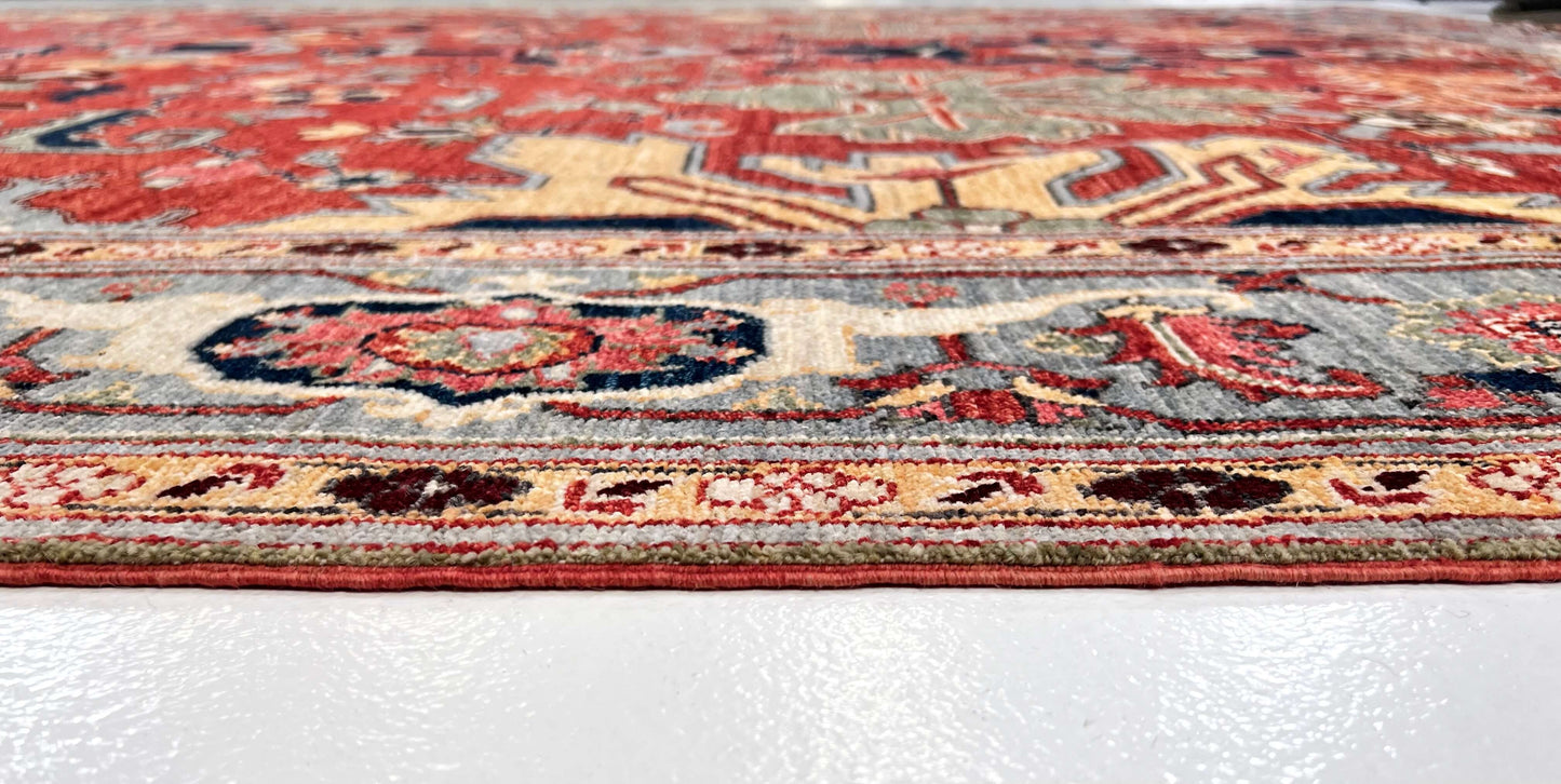 Afghan Heriz rug by Kirishian Rugs, 9'07" x 13'09", light red and light blue geometric pattern with intricate traditional design.
