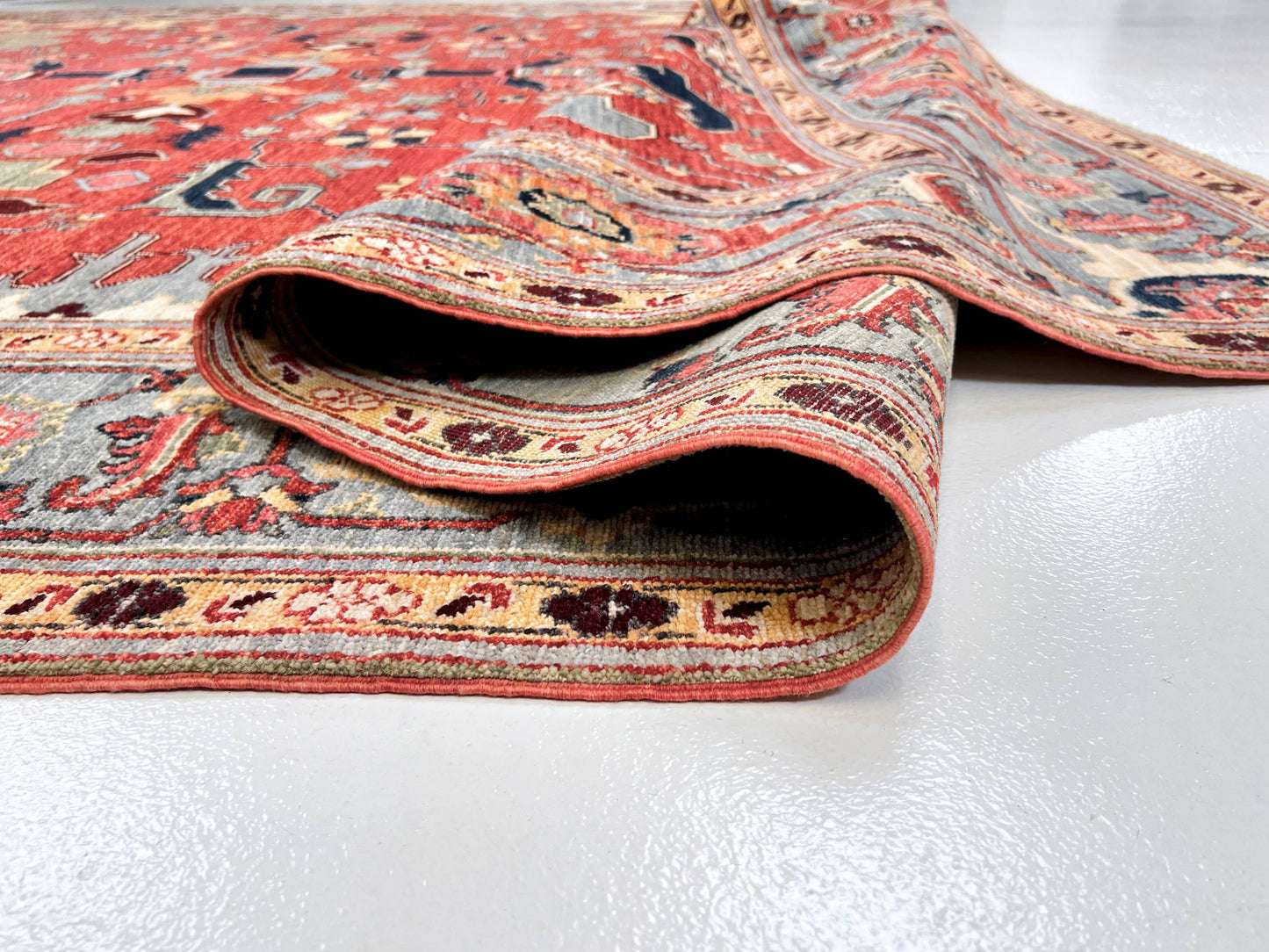 Afghan Heriz rug in light red and light blue with intricate geometric patterns, large size, by Kirishian Rugs.