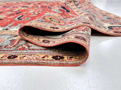 Afghan Heriz rug in light red and light blue with intricate geometric patterns, large size, by Kirishian Rugs.