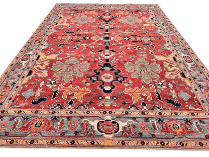 Afghan Heriz area rug by Kirishian Rugs, 9'07" x 13'09", with light red and light blue geometric patterns on woven fabric.