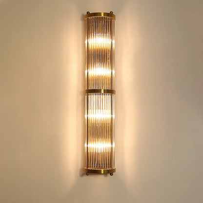 Korewolamp Jadssox crystal column wall light with sleek modern design and clear glass detailing, mounted on a wall.