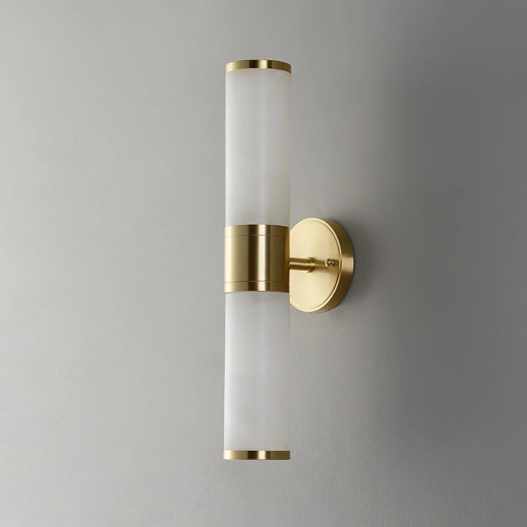 Alabaster Lampatron cylindrical wall lamp from korewolamp, featuring a sleek marble finish and modern wall lighting design.