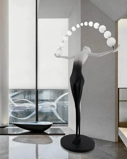 Korewolamp Liberty sculpture floor lamp with a detailed artistic figure, modern design, and a sleek metal base.