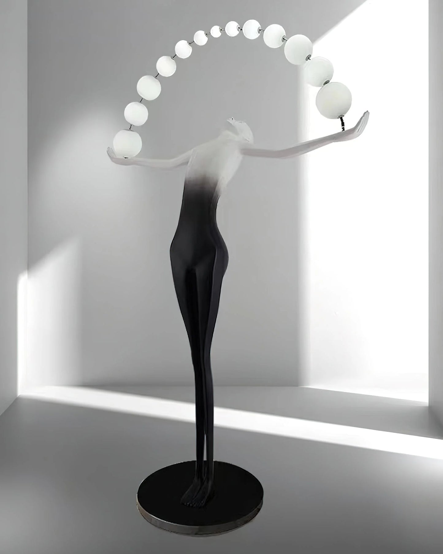 Korewolamp Liberty sculpture floor lamp with a detailed sculptural base and a tall, elegant lampshade for modern living rooms.