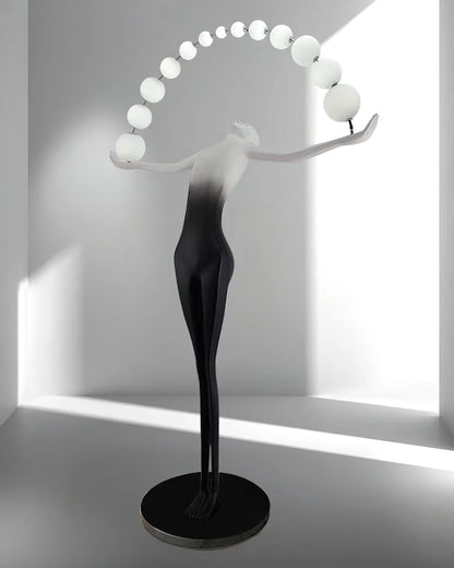 Korewolamp Liberty sculpture floor lamp with a detailed sculptural base and a tall, elegant lampshade for modern living rooms.