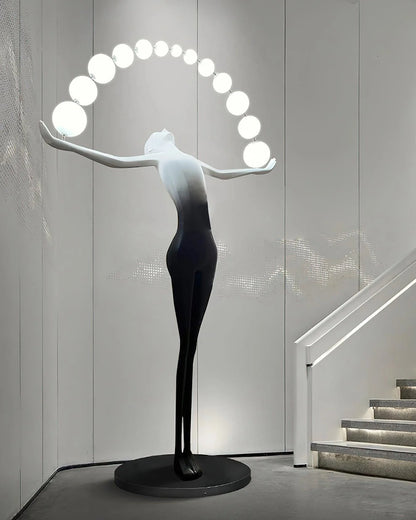 Liberty sculpture figure floor lamp by korewolamp with a detailed sculpture base and a tall, elegant lampshade.