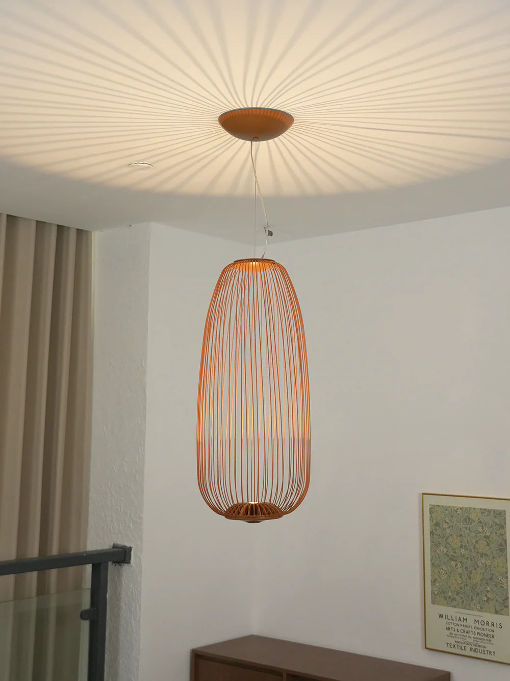 Korewolamp lightweight spokes-shaped pendant lamp with a modern cage design hanging from a ceiling fixture.