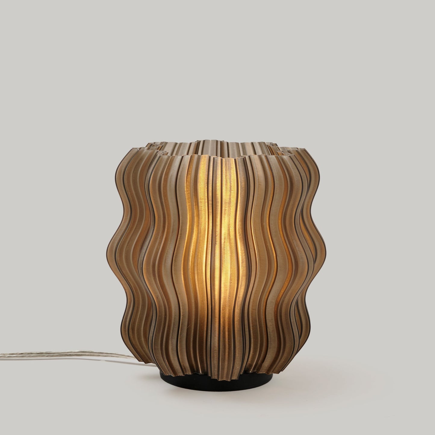 Mini Wavy Lamp by Wooj Design featuring a sleek, wavy silhouette in a smoke color finish.
