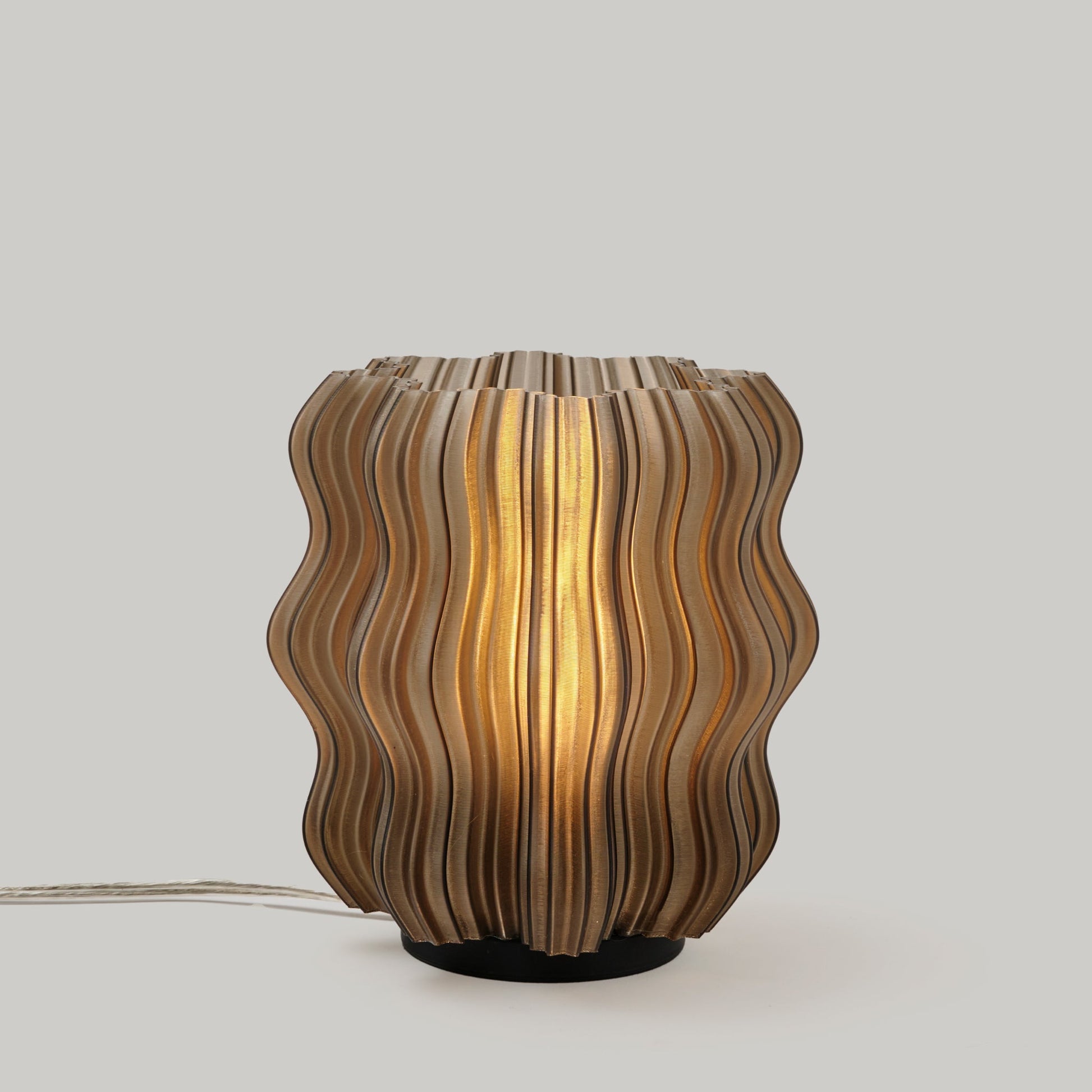Mini Wavy Lamp by Wooj Design featuring a sleek, wavy silhouette in a smoke color finish.