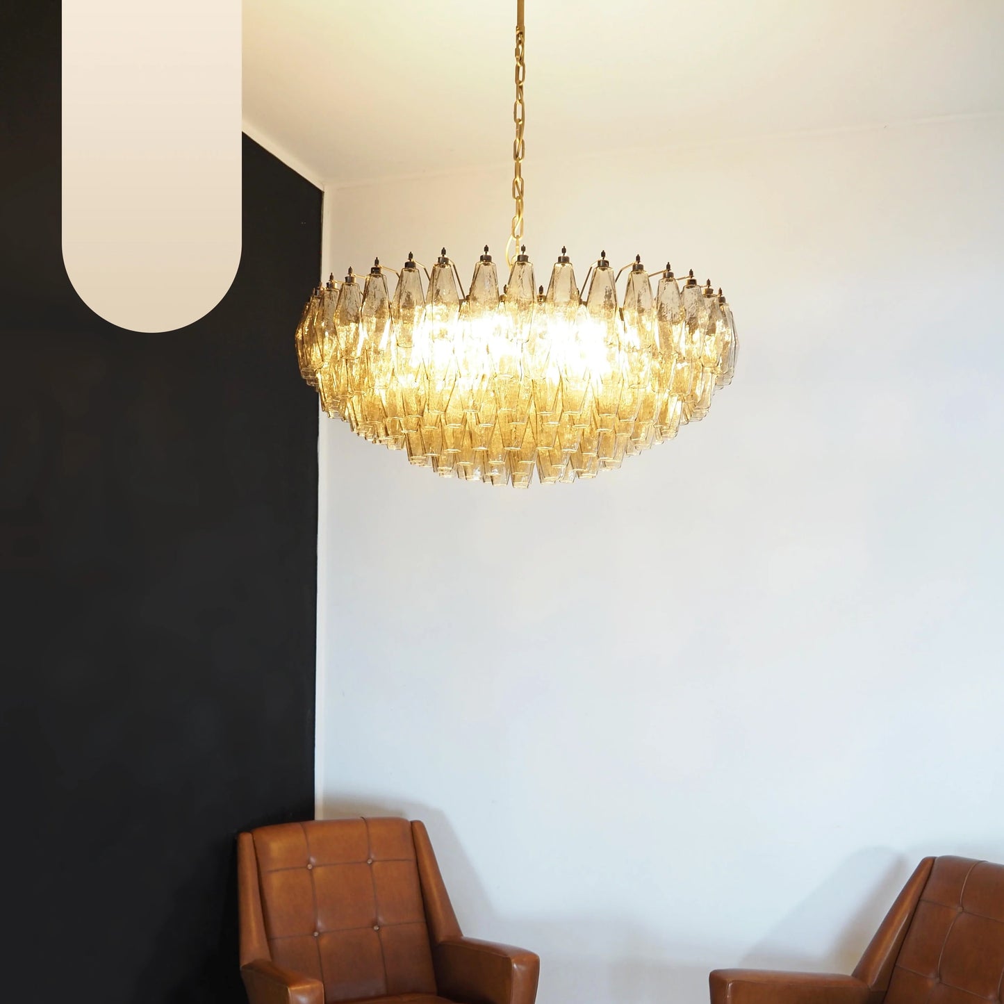 Murano faceted smoked glass chandelier by korewolamp with multiple glass prisms hanging from a metal frame.