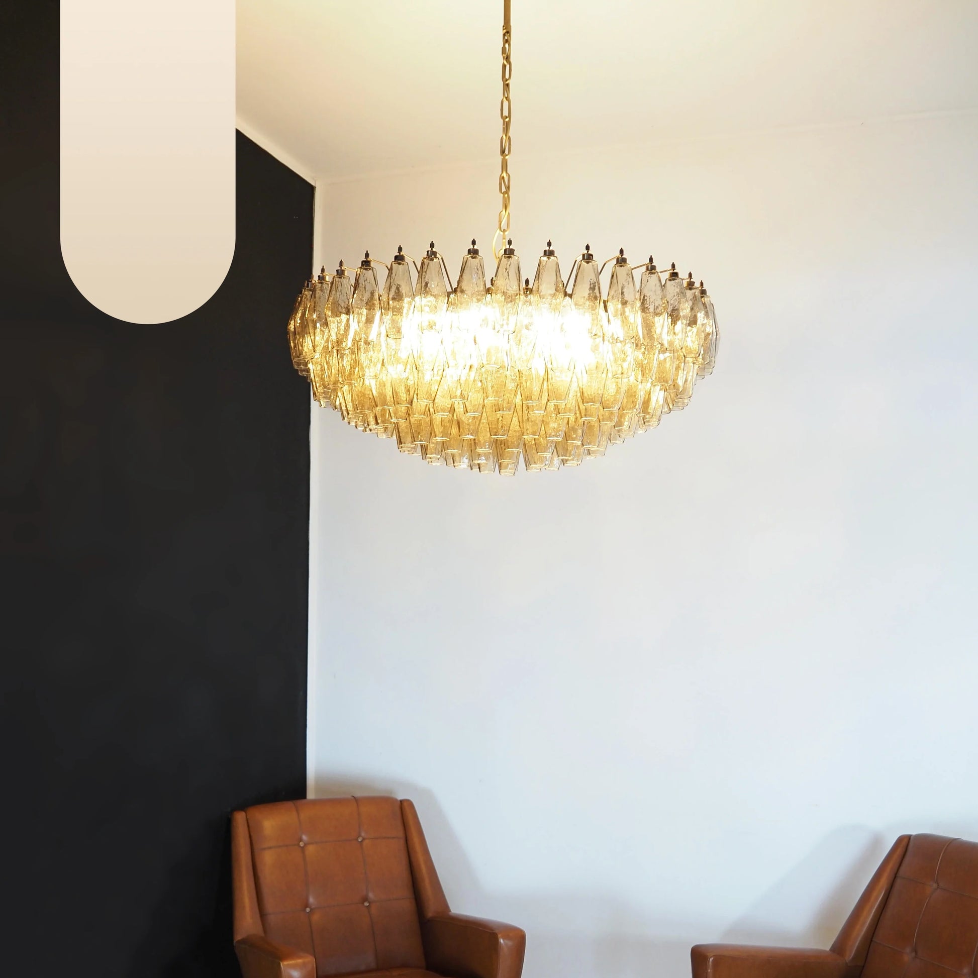 Murano faceted smoked glass chandelier by korewolamp with multiple glass prisms hanging from a metal frame.