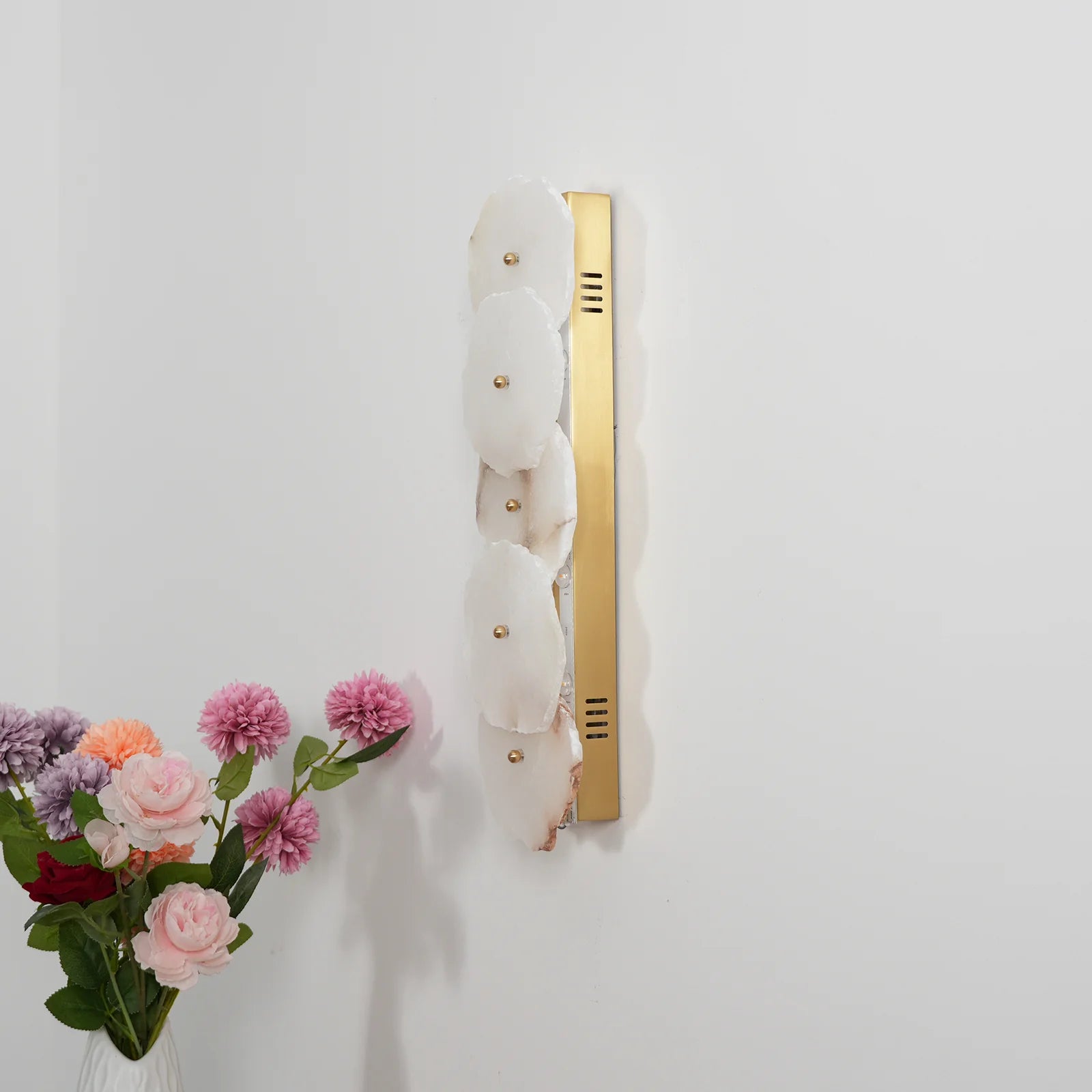 Korewolamp Petra wall lamp with sleek modern design, mounted on a wall, showcasing its minimalist style and warm lighting.