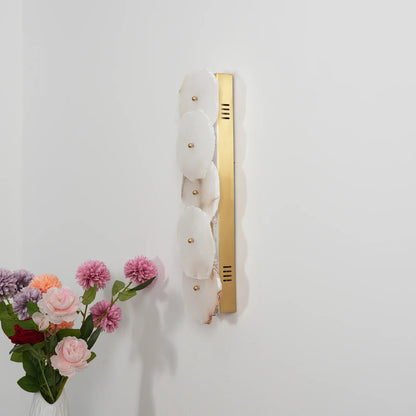 Korewolamp Petra wall lamp with sleek modern design, mounted on a wall, showcasing its minimalist style and warm lighting.