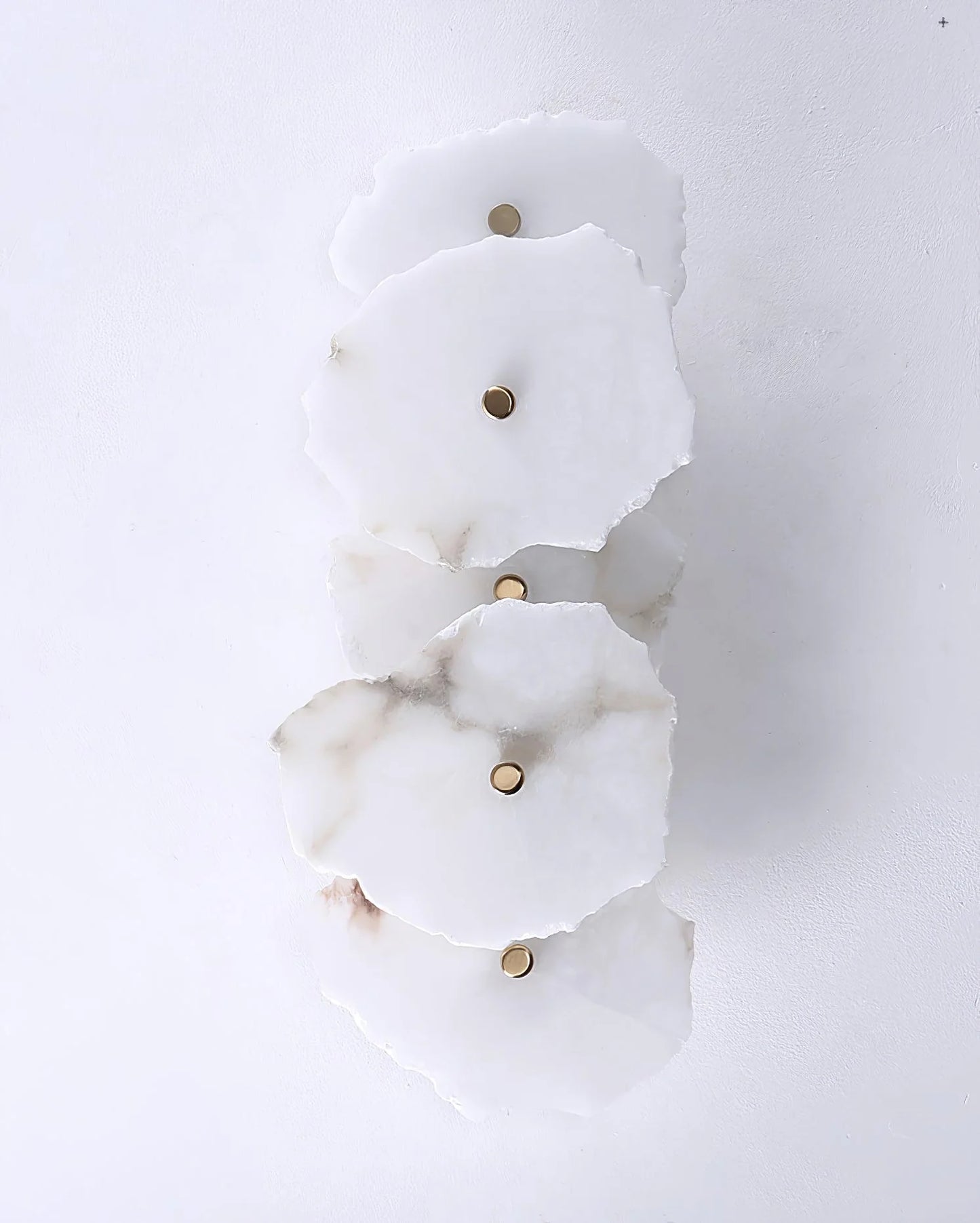 Korewolamp Petra wall lamp with sleek modern design, mounted on a wall, featuring a minimalist style and warm lighting.