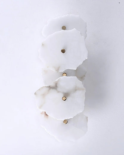 Korewolamp Petra wall lamp with sleek modern design, mounted on a wall, featuring a minimalist style and warm lighting.
