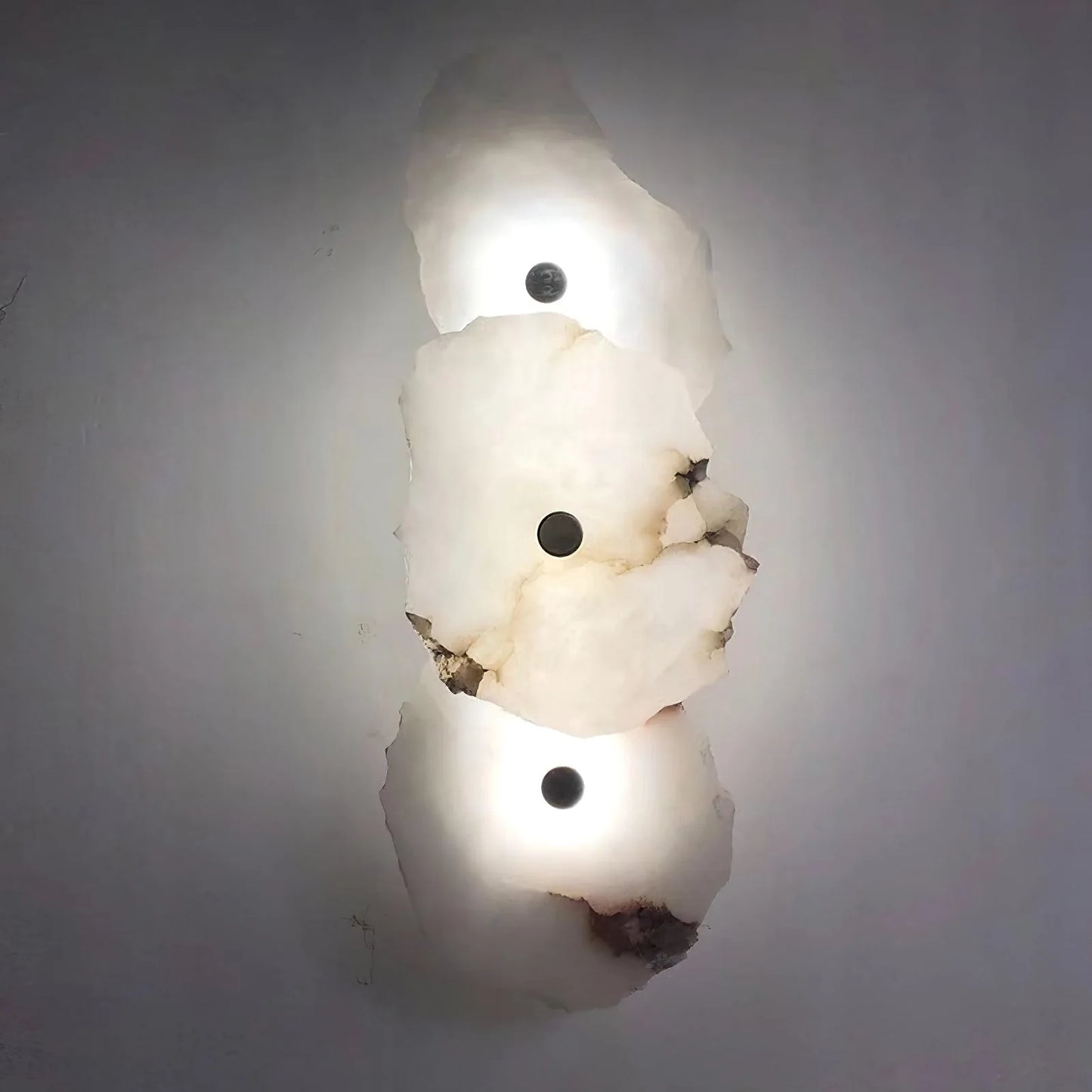 Korewolamp Petra wall lamp with sleek modern design, mounted on a wall, providing ambient lighting in a stylish interior space.