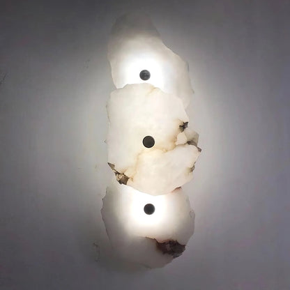 Korewolamp Petra wall lamp with sleek modern design, mounted on a wall, providing ambient lighting in a stylish interior space.