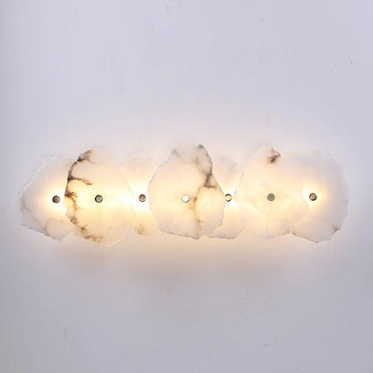 Korewolamp Petra wall lamp featuring a sleek, modern design with a warm-colored shade mounted on a wall.
