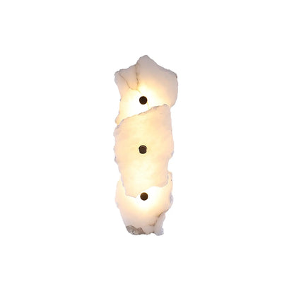 Korewolamp Petra wall lamp with sleek modern design, mounted on a wall, featuring a minimalist metallic finish and soft lighting.