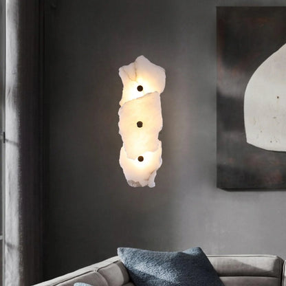 Korewolamp Petra Wall Lamp mounted on a wall with a modern design, featuring a sleek, minimalist metal finish.