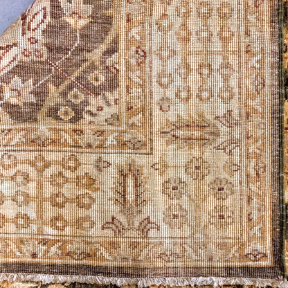 Kirishian Rugs Chobi-Cypress 4x12 runner with green and gold intricate geometric pattern on woven textile.