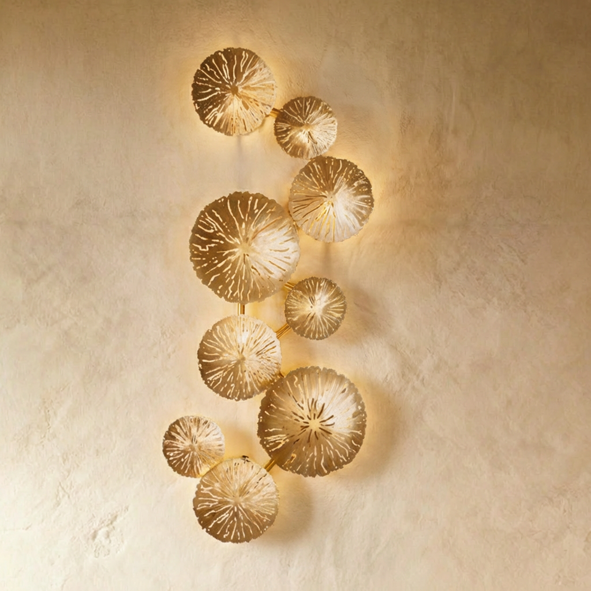 Aurelia Illuminated Art by Residence Supply featuring a detailed, illuminated sculpture of nine heads on a plain background.