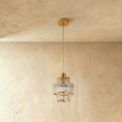 Gold Charagh pendant light by Residence Supply with intricate design, hanging from a ceiling fixture.